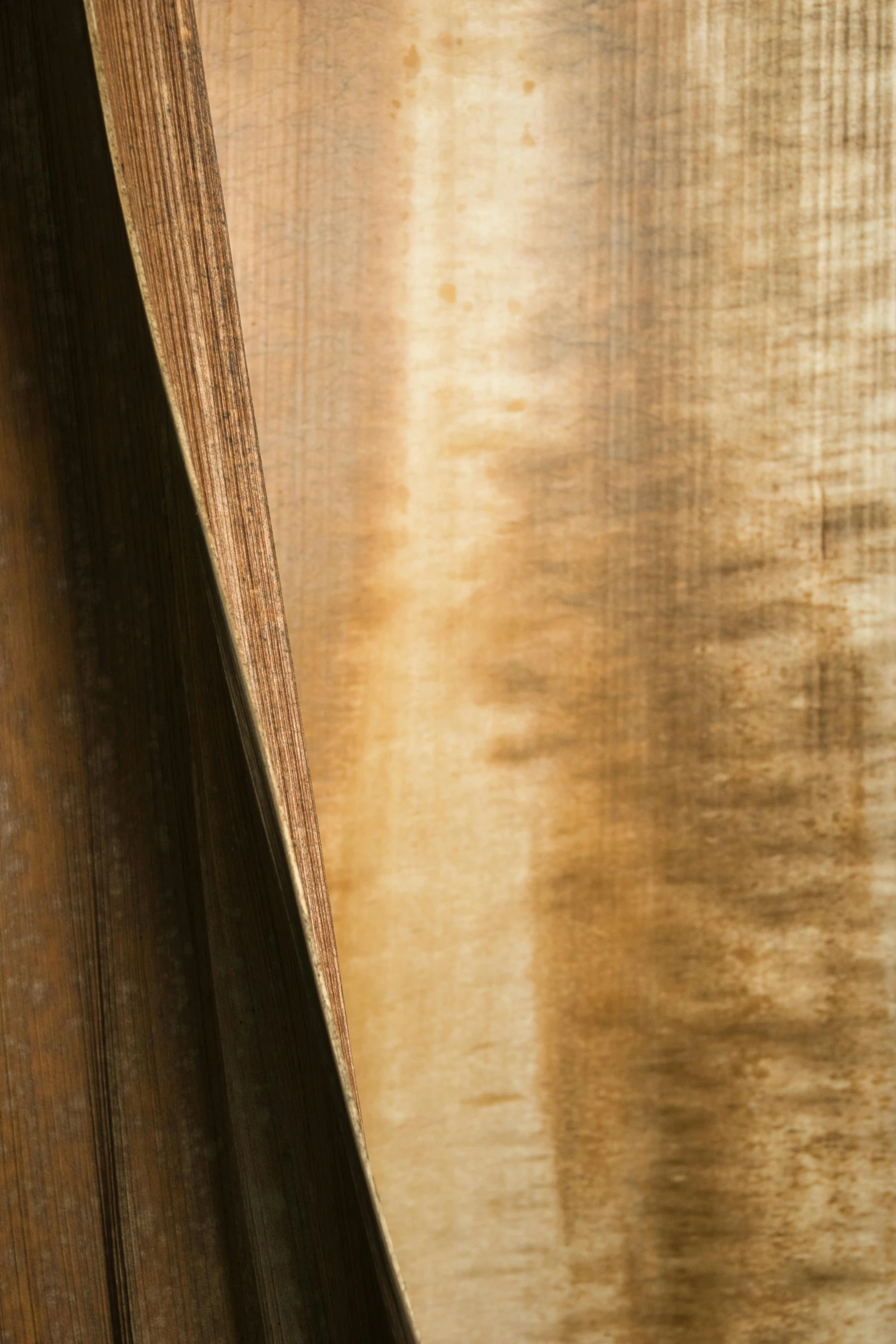 close up of a curtain in front of a brown background