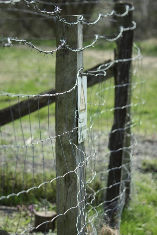 a fence with a sign on it that says danger