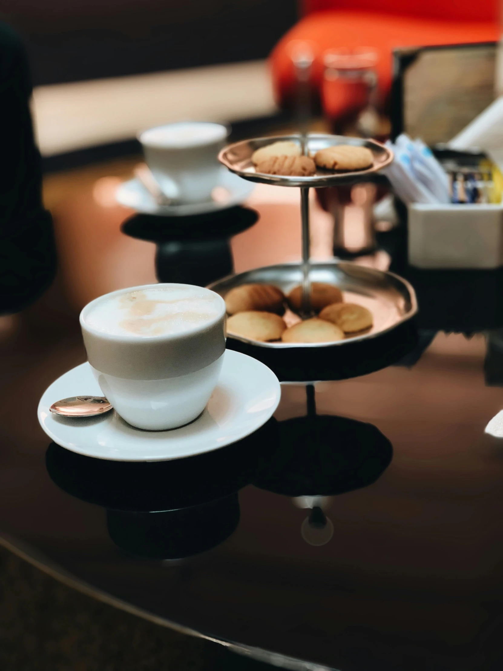 two plates and coffee cups sitting on a table