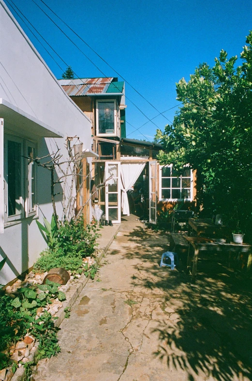 a fence is standing around a house near the trees