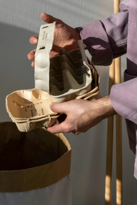 a person that is opening up an old shoe