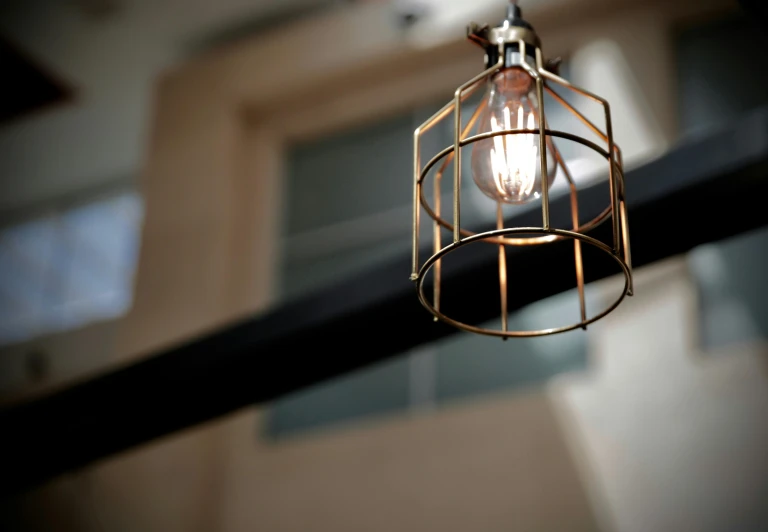 an old style light hanging from the ceiling