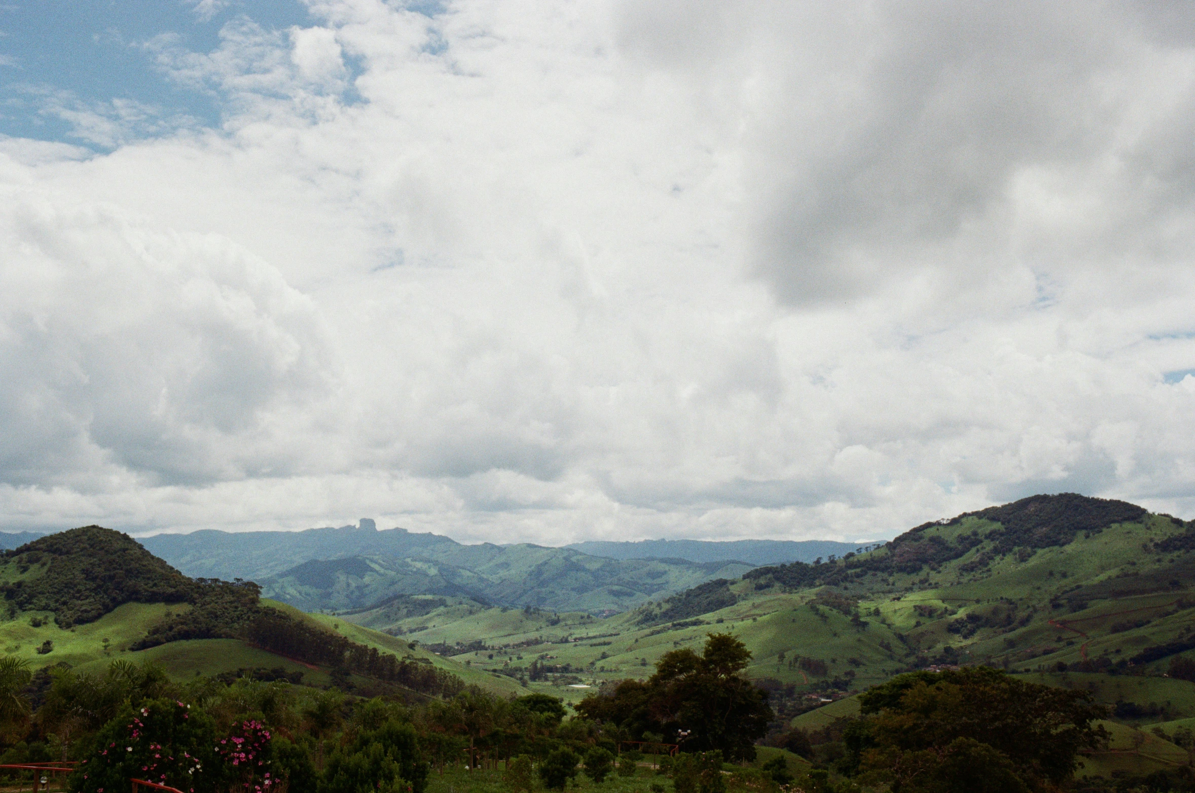 there is a beautiful green landscape on this hilltop