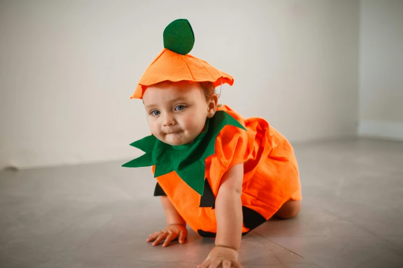 a baby dressed in a very cute outfit