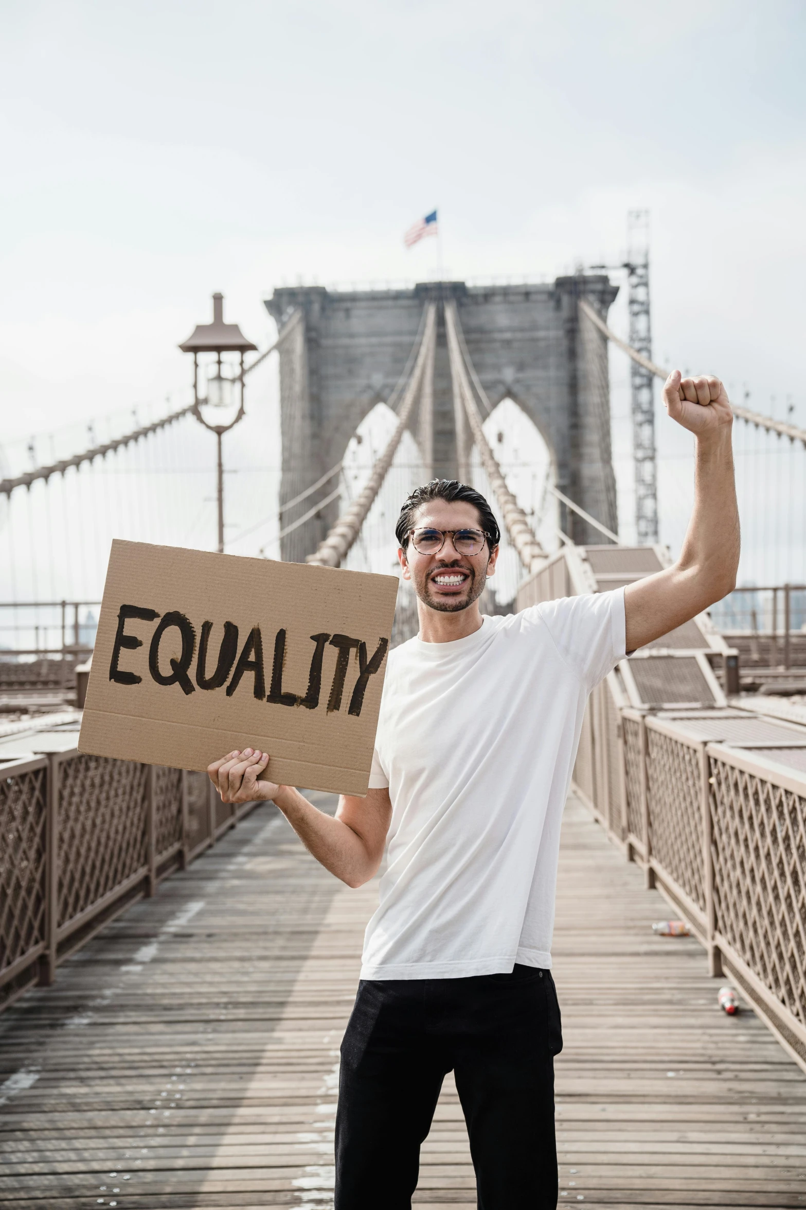 a man is standing on the pier holding a sign