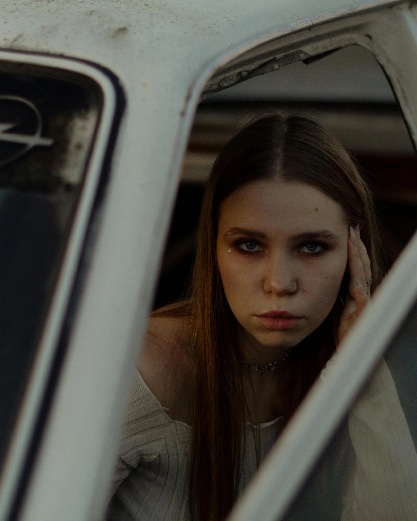 a woman sitting in a car looking angry