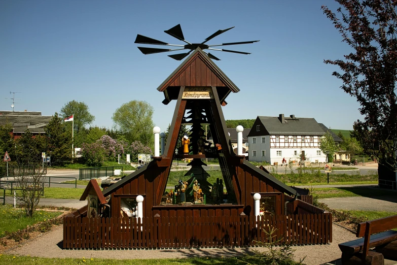 a wooden structure with some metal gear attached to it