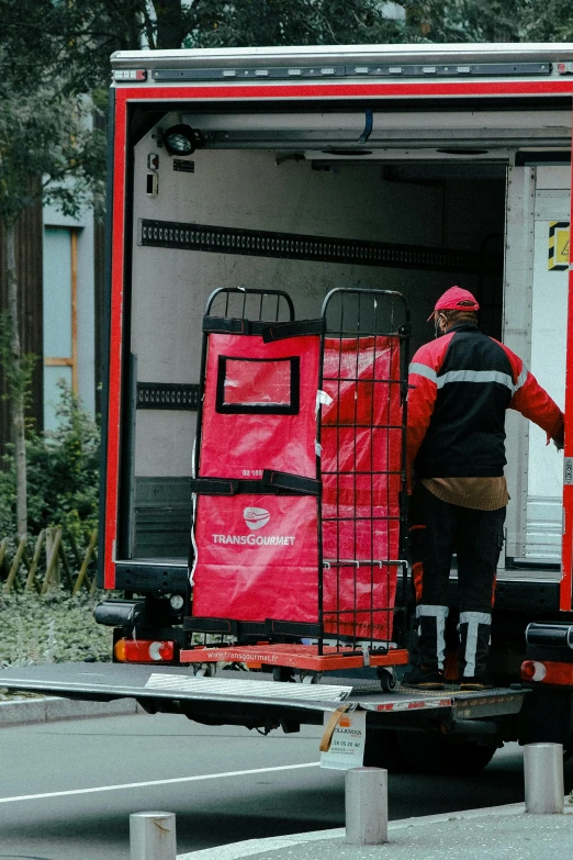 a truck with several people standing next to it