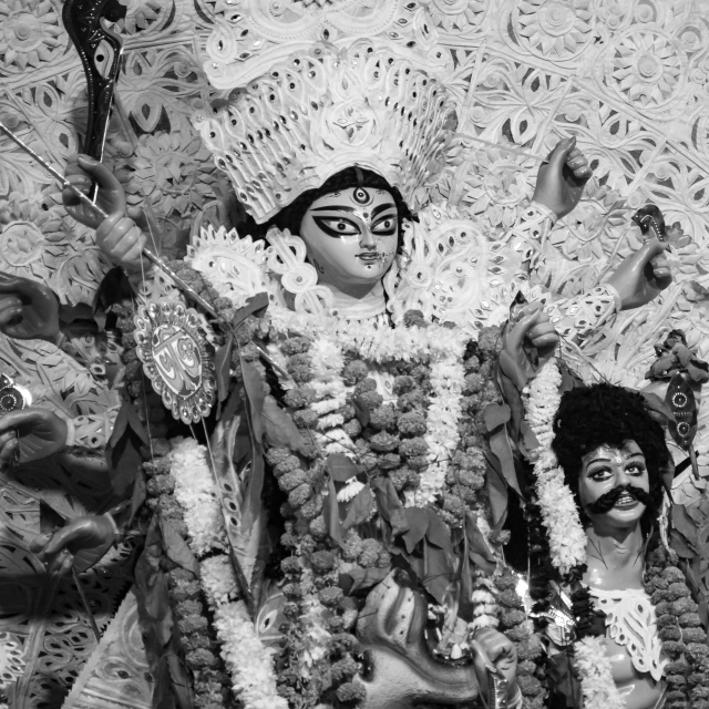 a man in costume and decorations with other men in masks