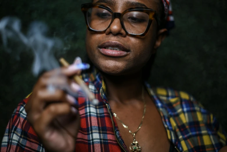 a woman smoking a cigarette with glasses