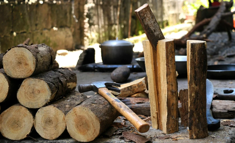 many logs are stacked together in front of many pots