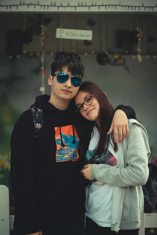 two people are posing together in the street