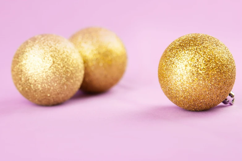an image of some gold decorations on purple background