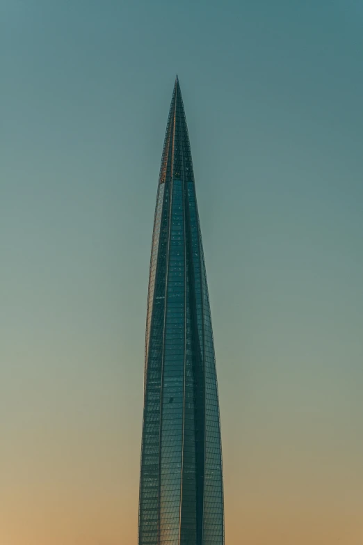 the view of an unique curved skyscr building, from across the street