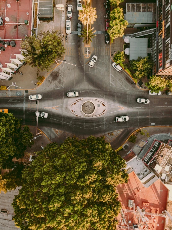 an aerial view of two streets and an intersection in an urban area