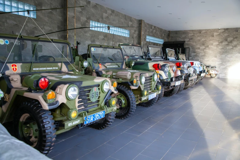 a line up of military vehicles in a building