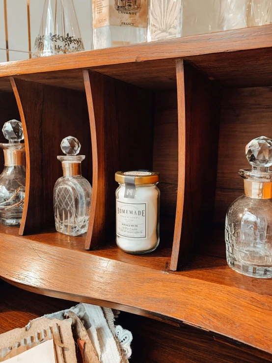 a shelf is covered with jars and jars