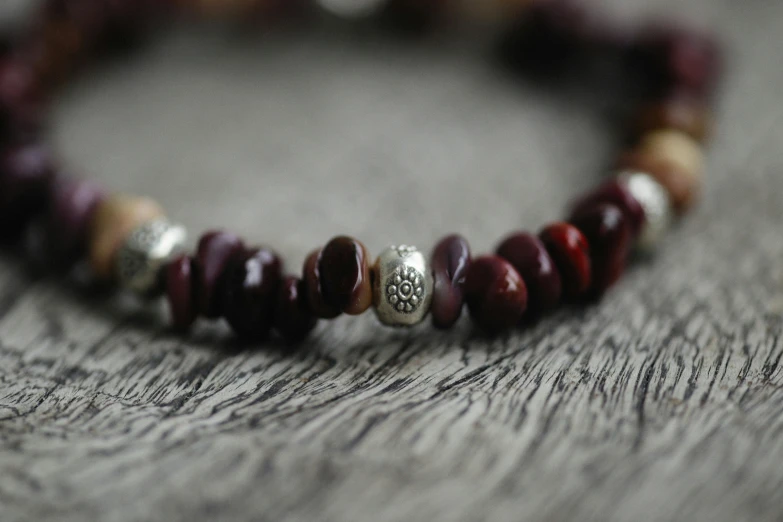 a celet with beads sitting on a table