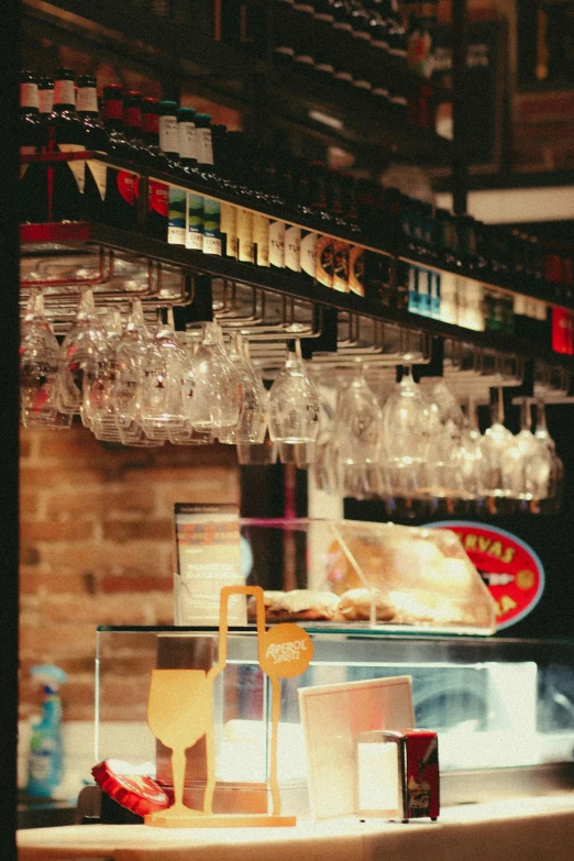 wine glasses and empty liquor bottles in a store window