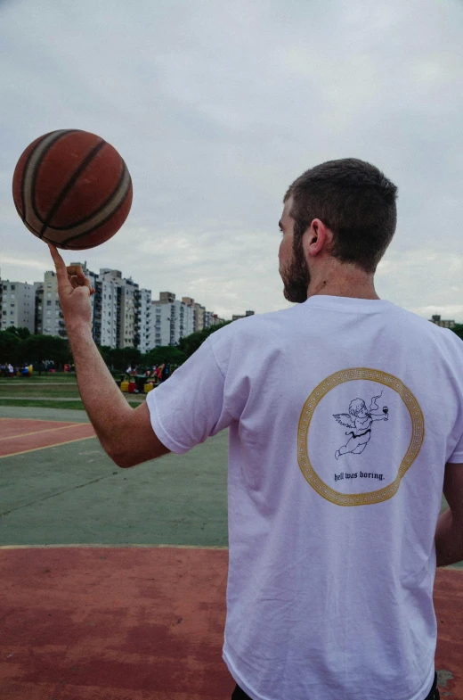 a man who is spinning a basketball around