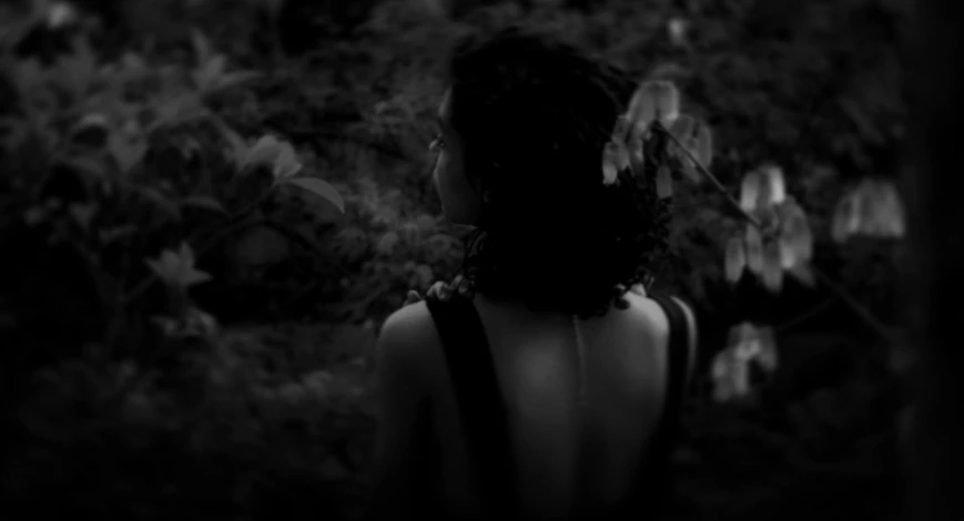 the back of a woman's head with wings above her