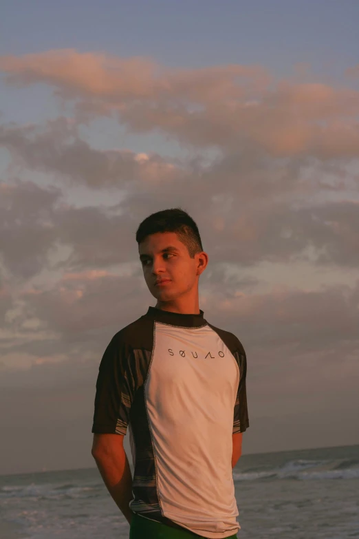 a person on the beach in front of the water