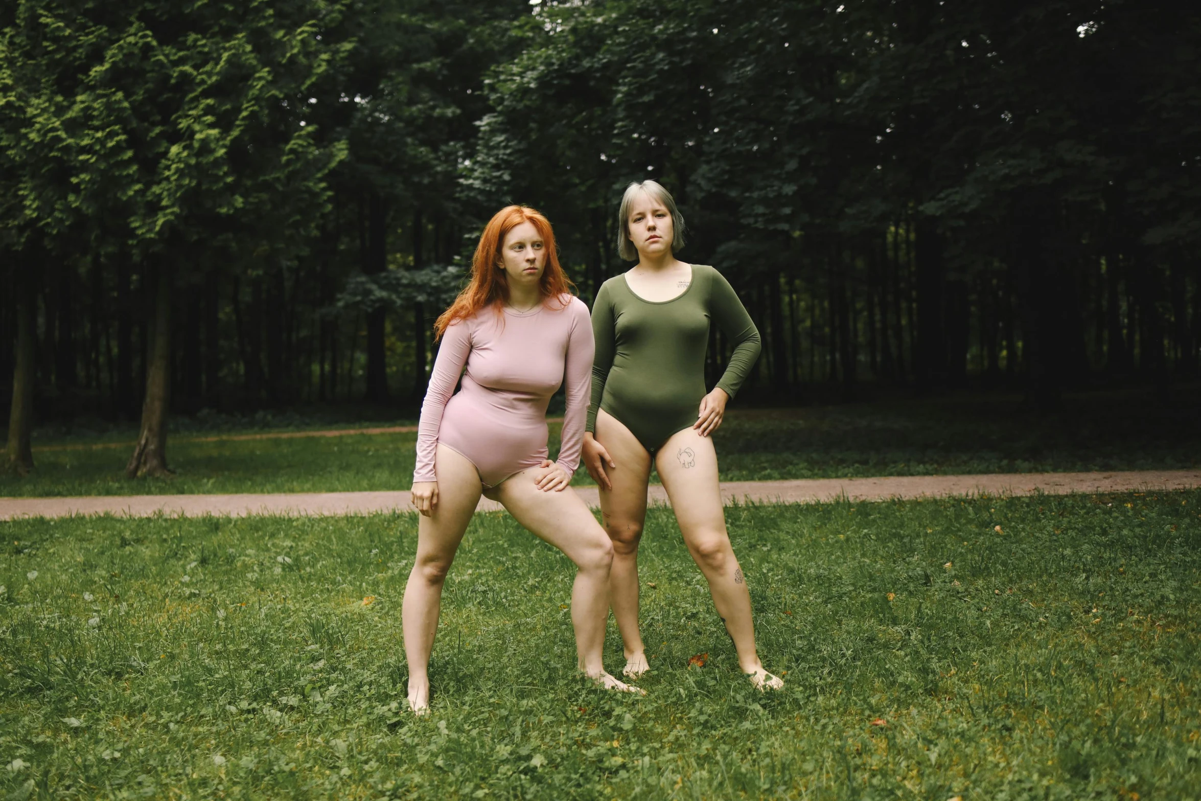 two women in their underwear are posing for a po