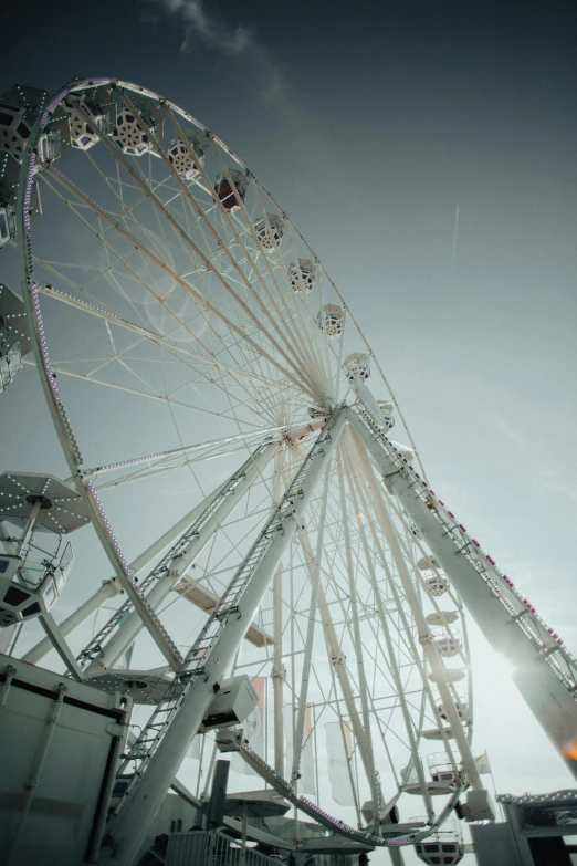 large ferris wheel with several rides and light on