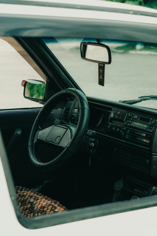 a small white car with a steering wheel and other items