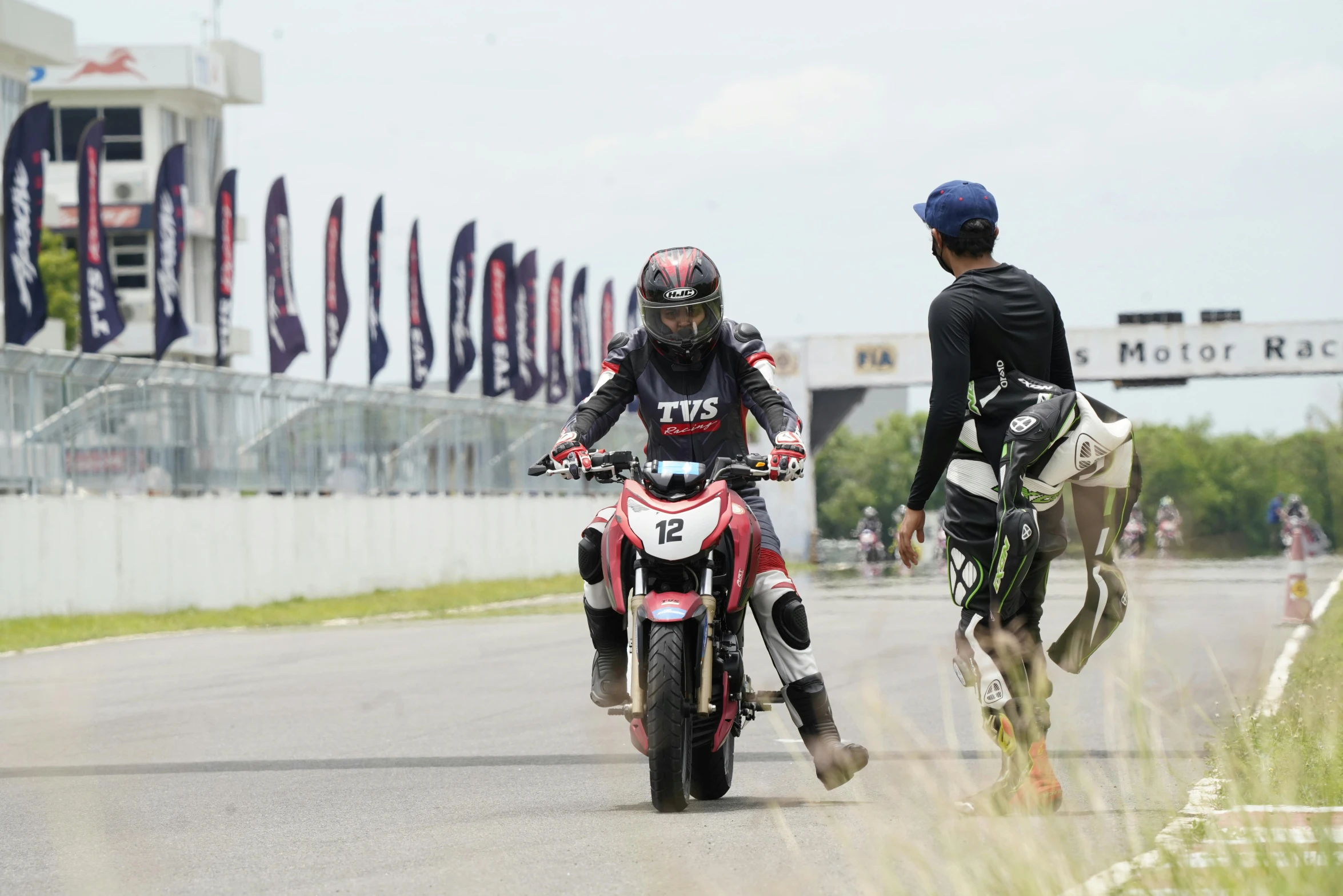 a couple of people riding motorcycles next to each other