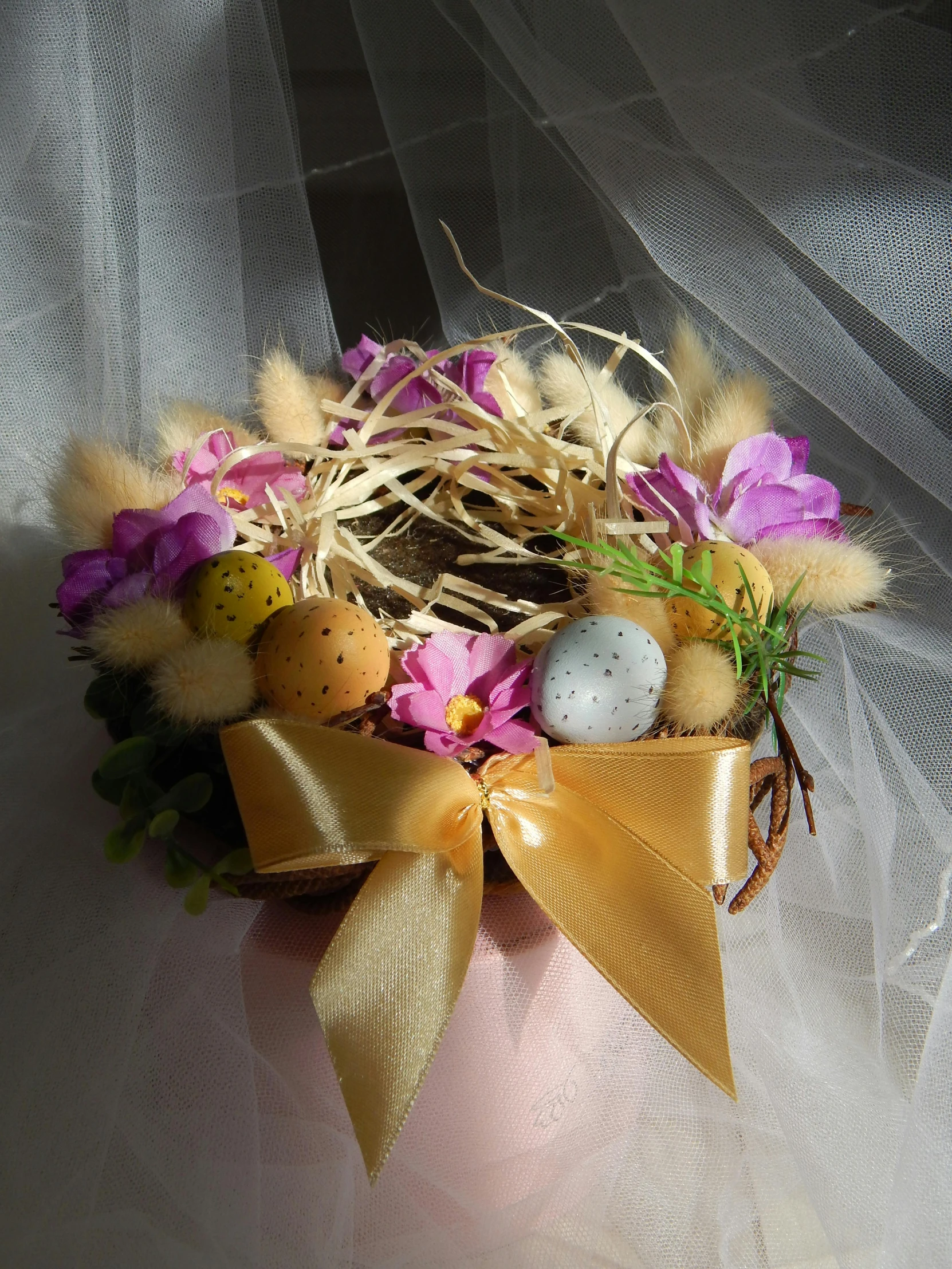 this is a handmade crown with flowers and eggs