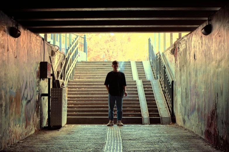 a man is standing alone on a stairway