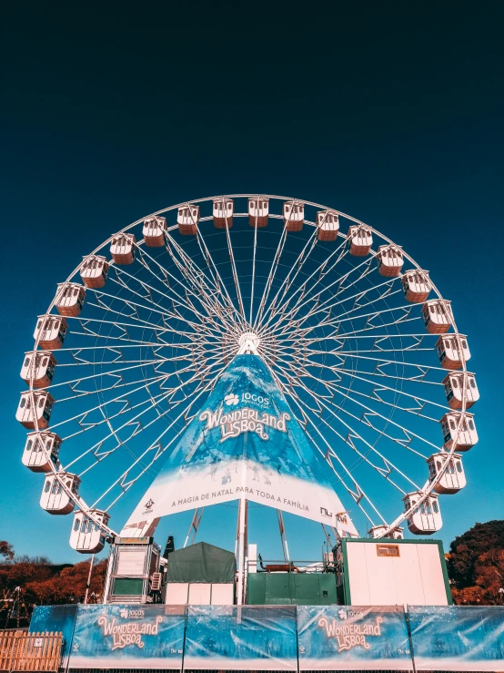 the large ferris wheel has a white canopy