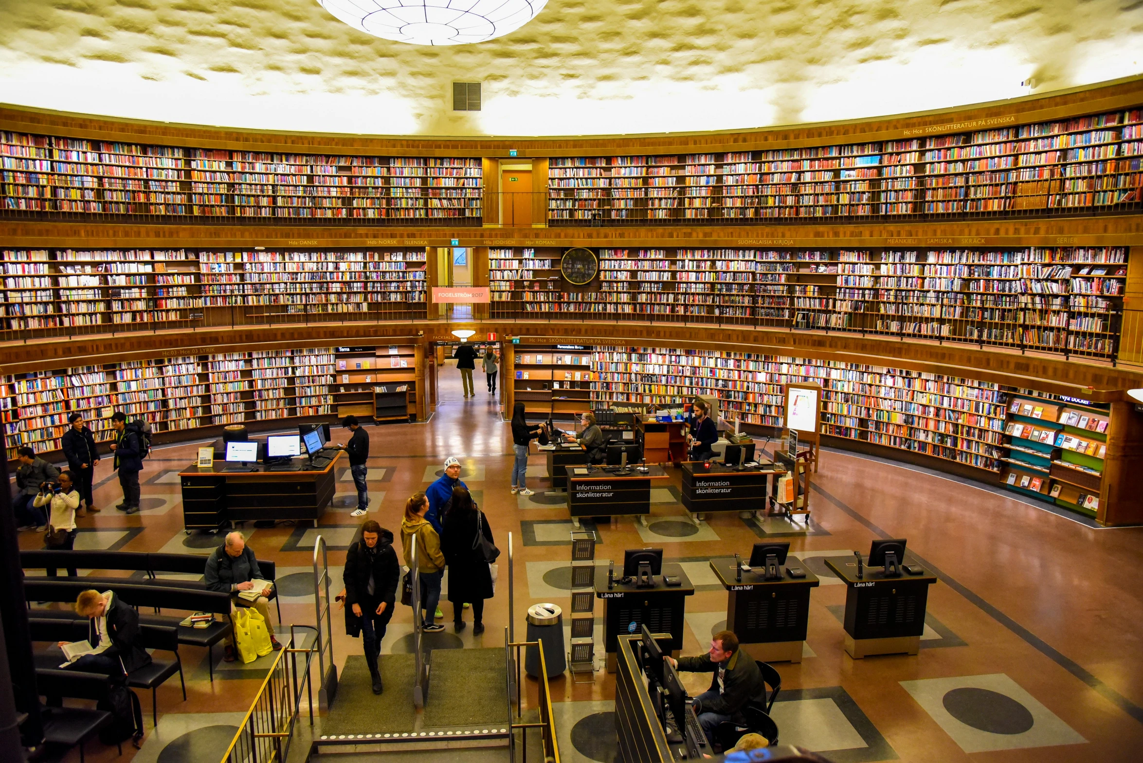 this large room is full of books on a wall