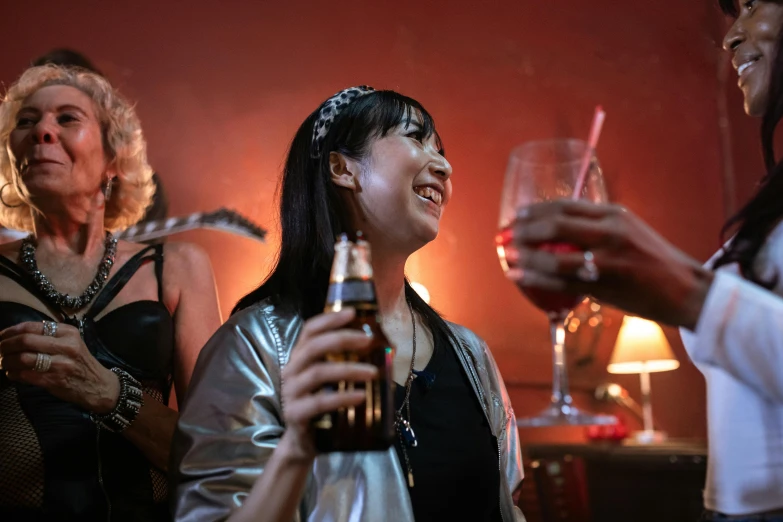 a group of women at a party drinking alcohol