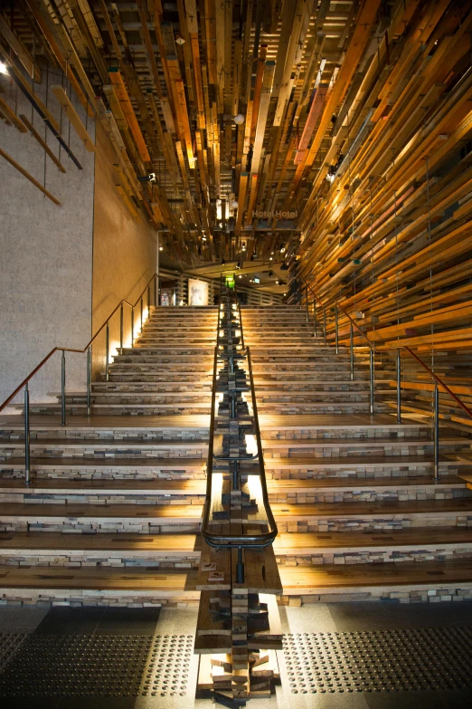 an empty set of stairs with lights shining down