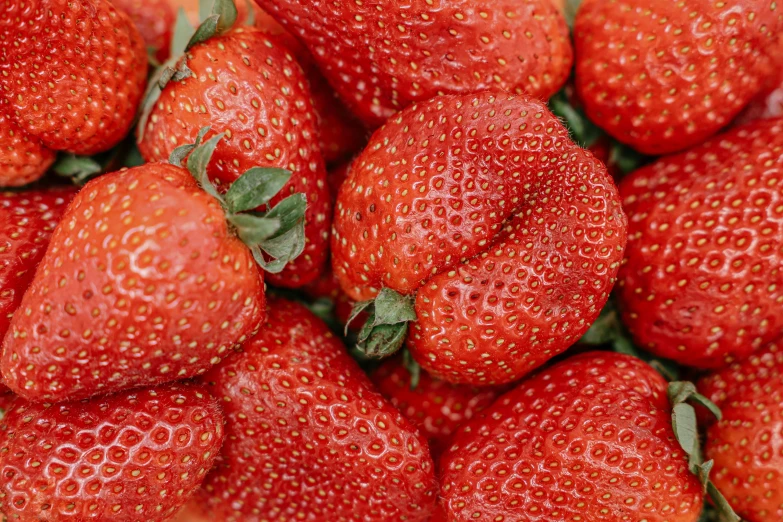 some very big and tasty looking strawberries together