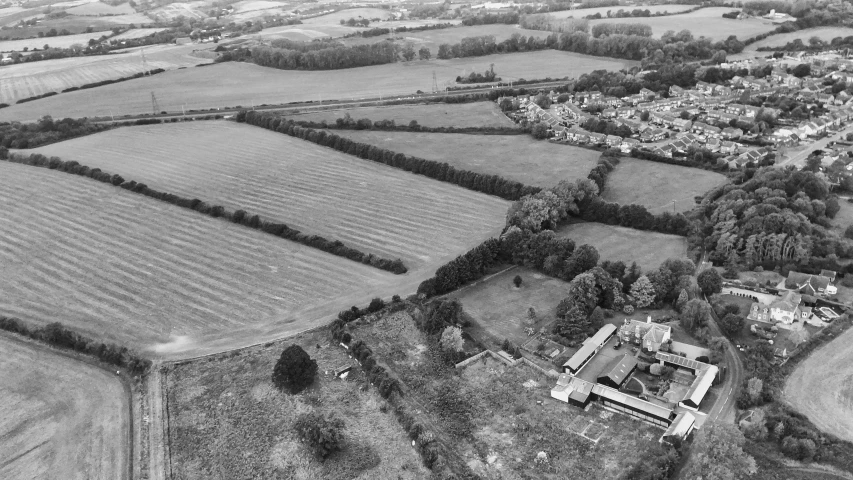 an aerial view of a field and city