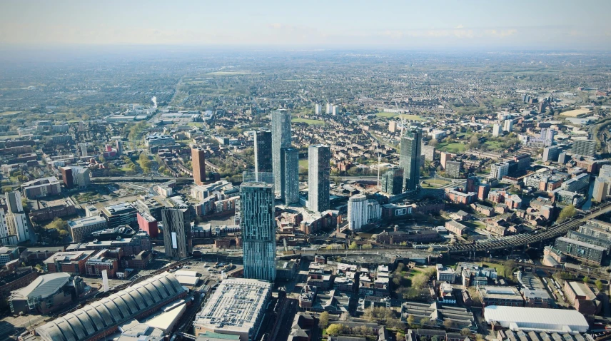 an aerial view of a city with tall buildings