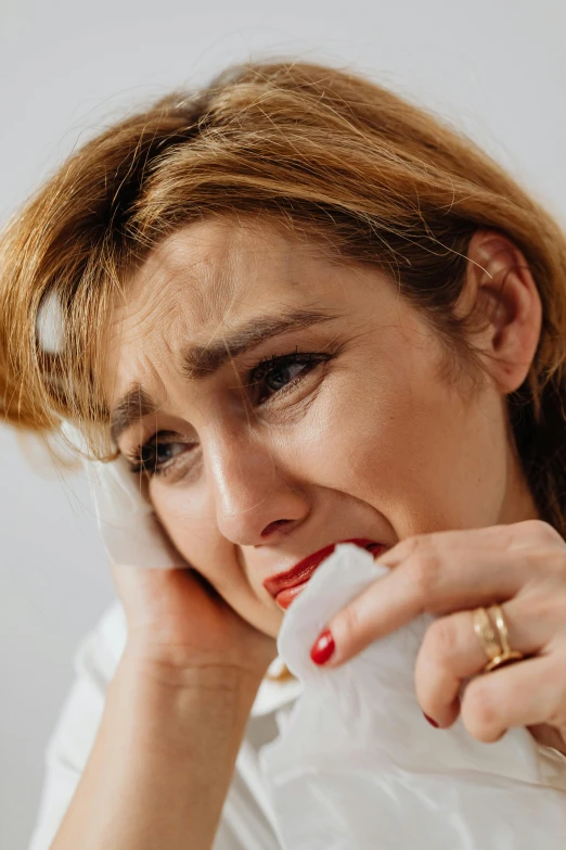 a close up of a person talking on a phone