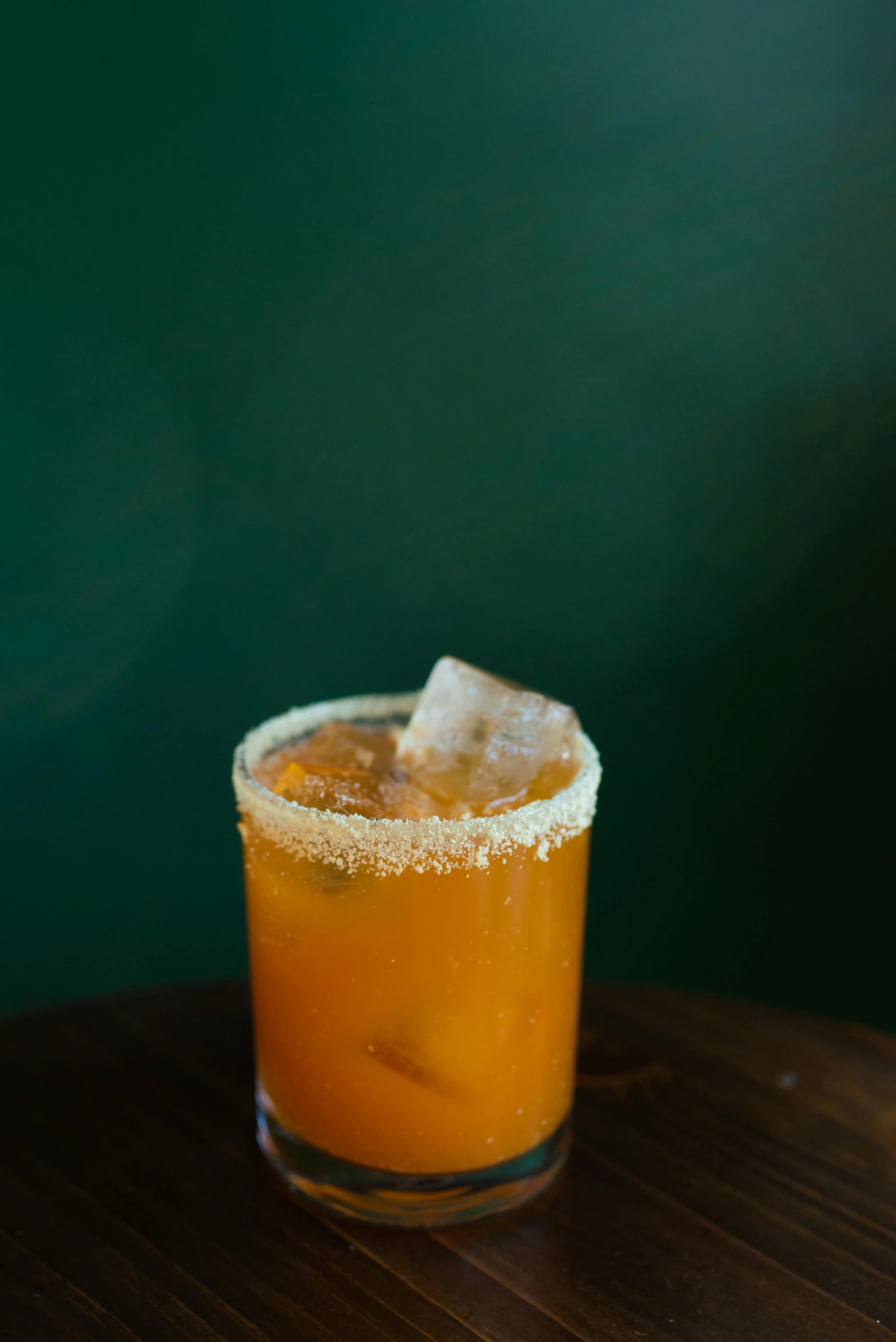 a drink sitting on top of a table covered in sugar