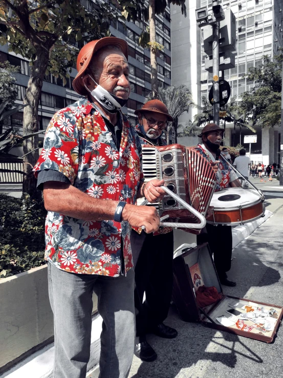 an elderly man is playing the musical instrument