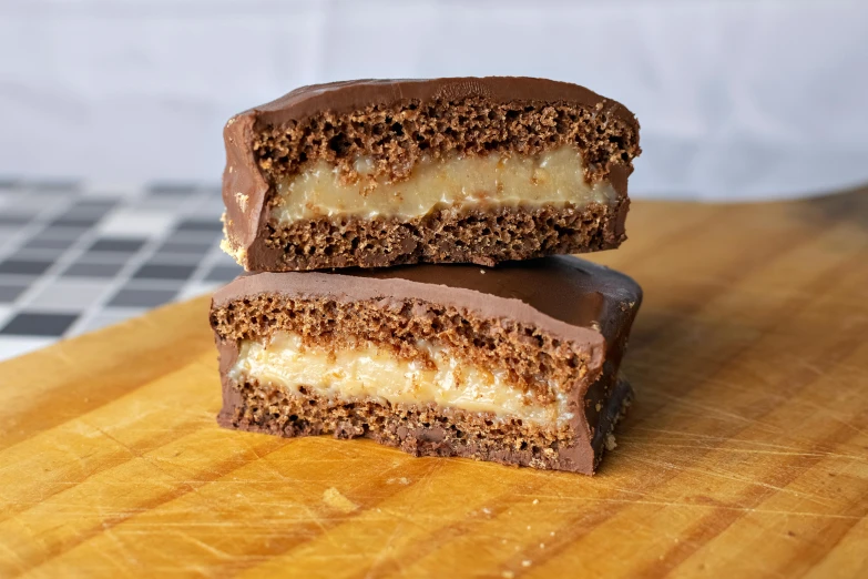 a couple of brownies sitting on top of a wooden  board