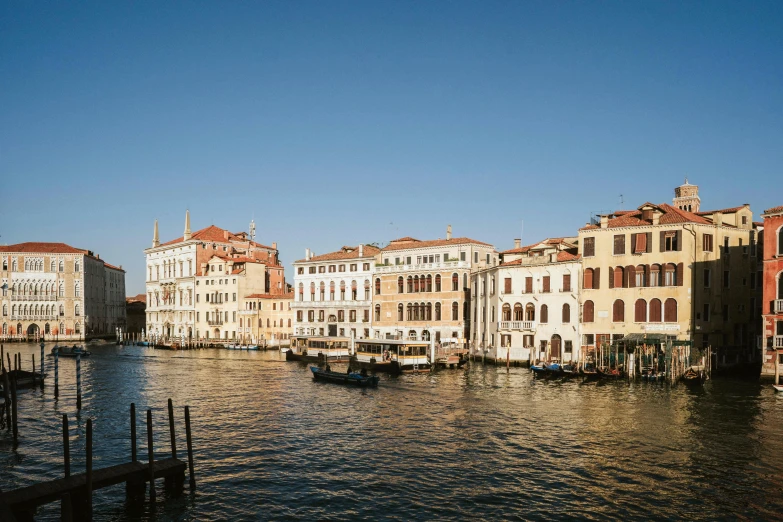 some water buildings and boats on the water