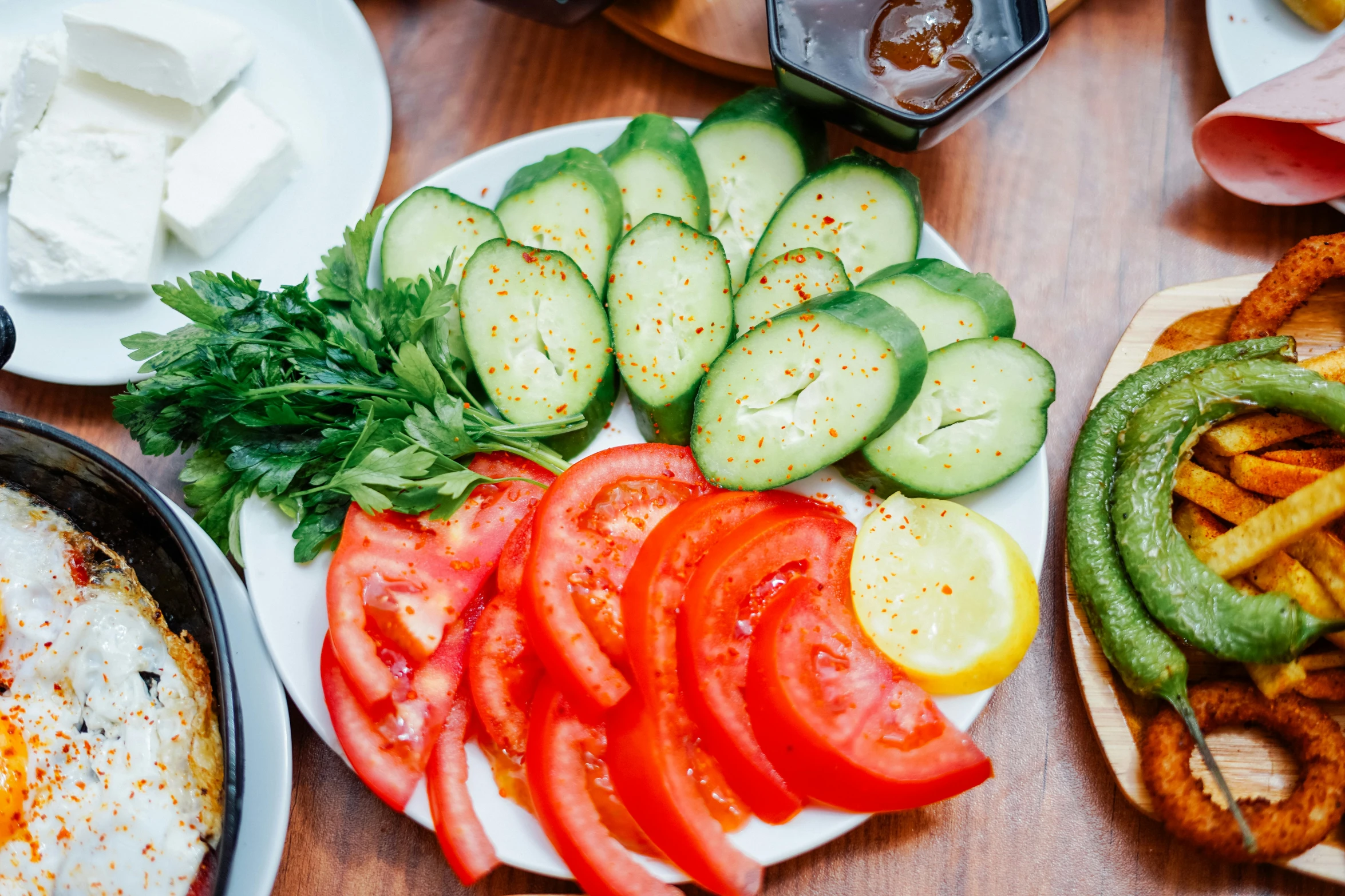 vegetables and toast served with sour cream on wooden table