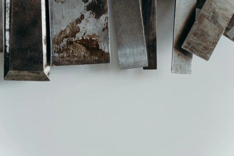 several different metal objects in an arrangement with white background