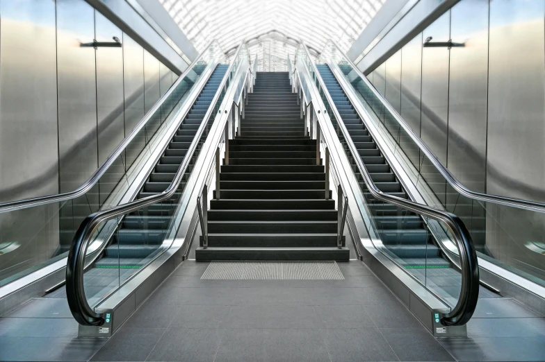 the escalator in the airport has metal steps