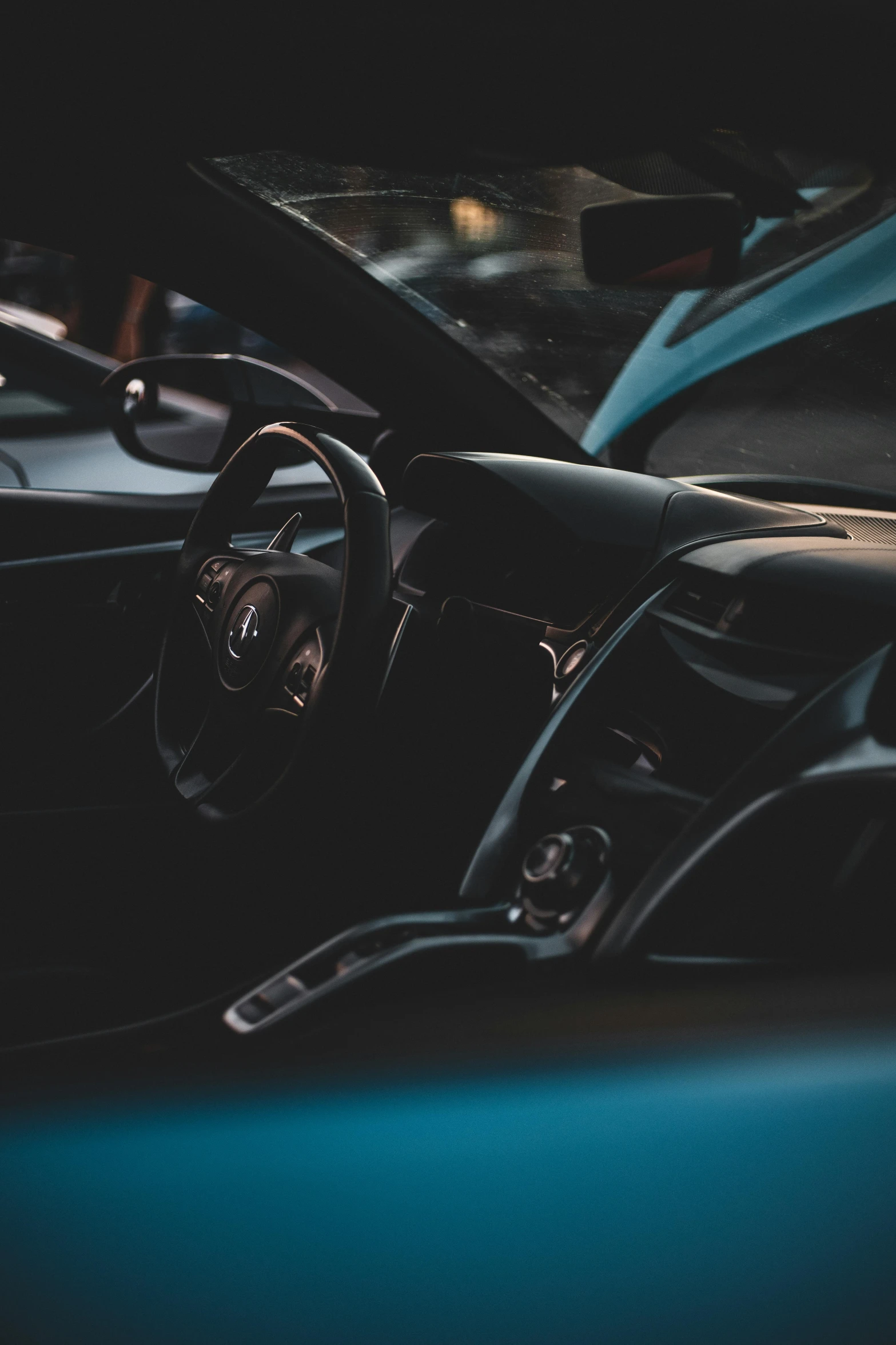 the inside of a car that has a blue floor