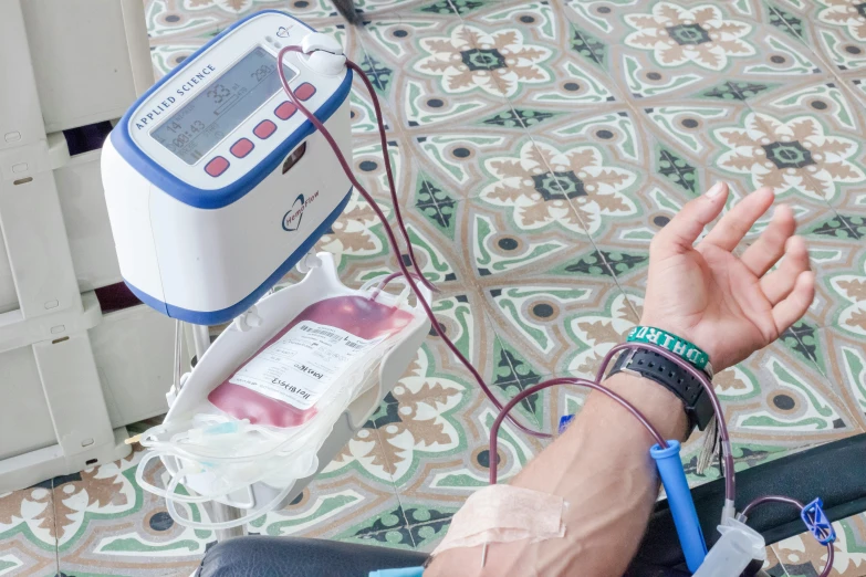 a close up view of a wrist with an electric device in it