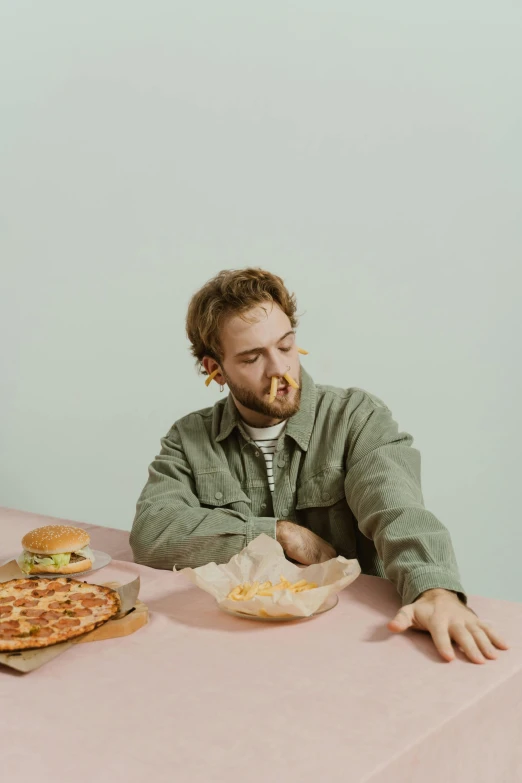 a man sitting at a table eating food